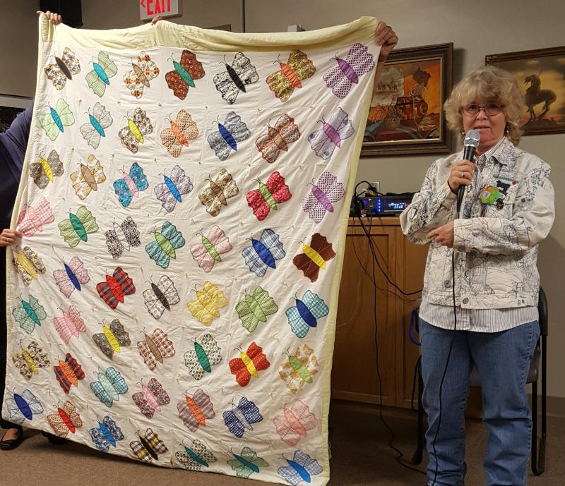 Deb with a vintage butterfly quilt- like the April BOM
