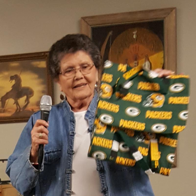 Patsy shows a Green Bay Packers casserole carrier