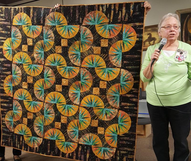 Alice has completed a paper pieced batik quilt. Taught in class with Judy Niemeyer in 2005.  Block is Drunkards Path-- but Alice renamed quilt Wandering Paths(Judy N), to Emerald Pools--inspired by hike in Zion Natl. Park.  Beautifully quilted by Anita A