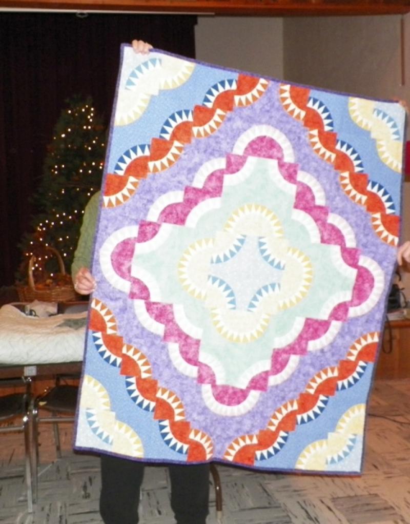 Paper pieced baby quilt for great granddaughter shown by Ann D.