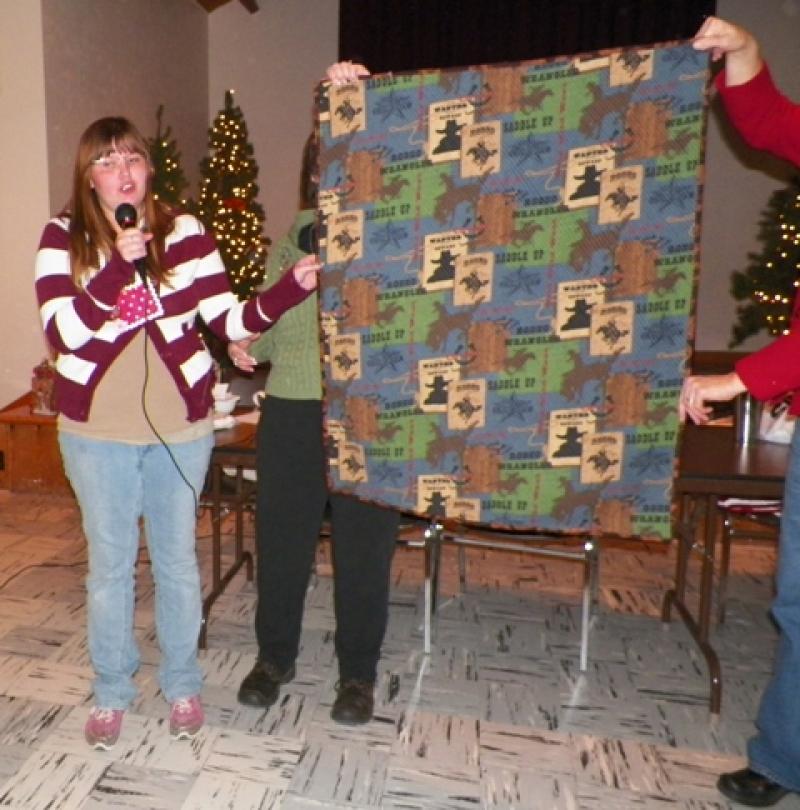 Bonnie G shows an heirloom cut crib quilt for one of her triplets.