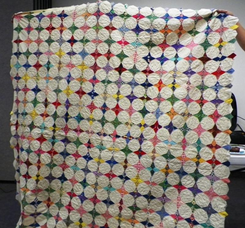 Colleen G shows an Antique quilt she is finishing for a friend.