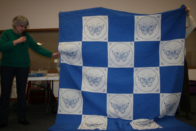 Janice's Blue & White cross stitched Anniversary Quilt made by her Aunt for her parents' 40th anniversary