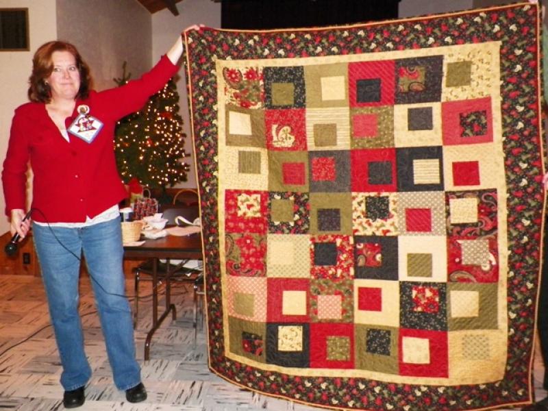 Christmas quilt with cording in the binding shown by Jody M.