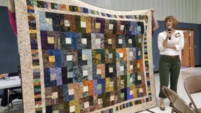 Scrappy Batik quilt made by Lari with help from her grandson
